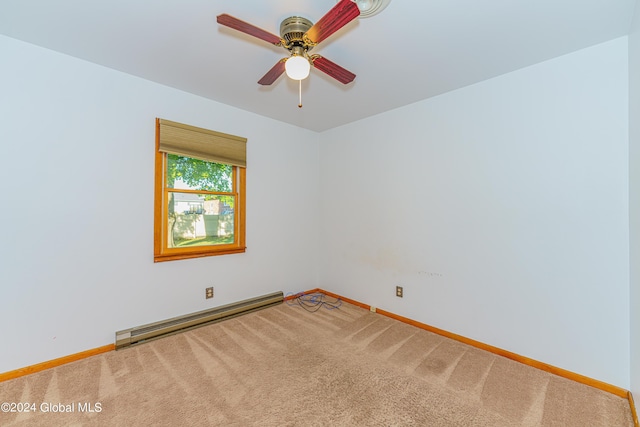 empty room with a baseboard heating unit, carpet, baseboards, and ceiling fan