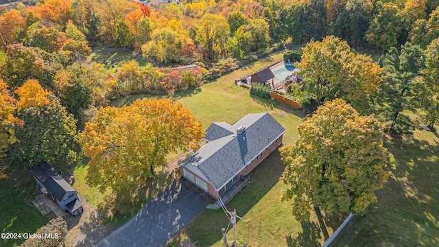 aerial view featuring a wooded view