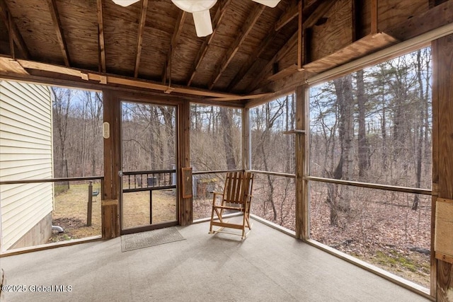 unfurnished sunroom with vaulted ceiling and ceiling fan