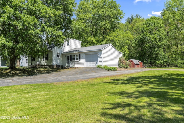 68 Wemple Rd, Bethlehem, NY 12054 - view of front facade with an attached garage, asphalt driveway, a front lawn, and a shingled roof