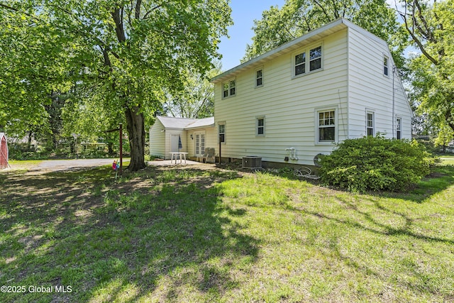 68 Wemple Rd, Bethlehem, NY 12054 - rear view of property featuring a yard, central AC unit, and a patio area