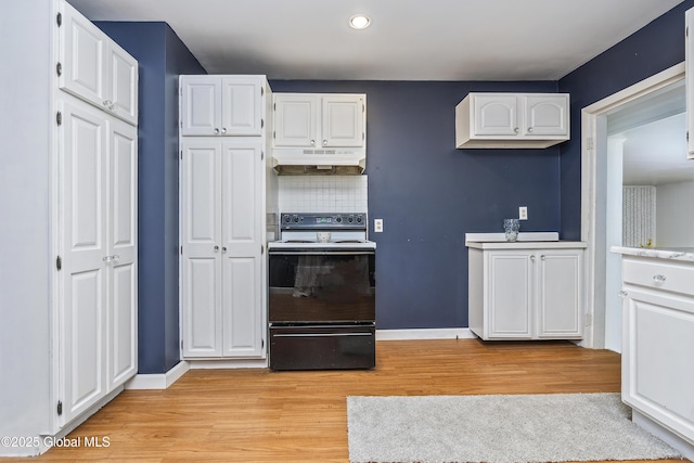 68 Wemple Rd, Bethlehem, NY 12054 - kitchen with electric range, under cabinet range hood, white cabinets, light wood-style flooring, and recessed lighting