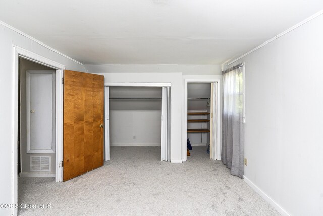 68 Wemple Rd, Bethlehem, NY 12054 - unfurnished bedroom featuring carpet floors, multiple closets, ornamental molding, and baseboards