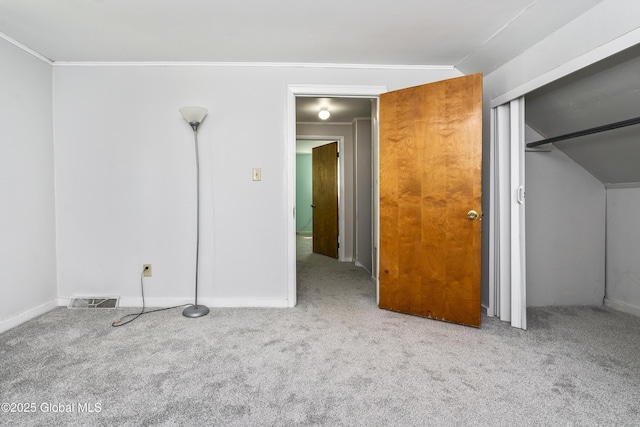 68 Wemple Rd, Bethlehem, NY 12054 - unfurnished bedroom featuring carpet, vaulted ceiling, a closet, baseboards, and ornamental molding
