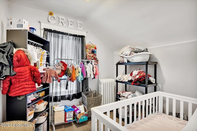 carpeted bedroom featuring radiator heating unit and lofted ceiling