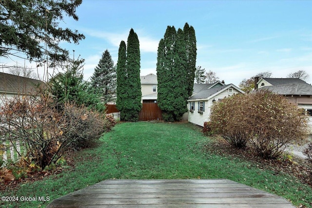 view of yard with a deck and fence