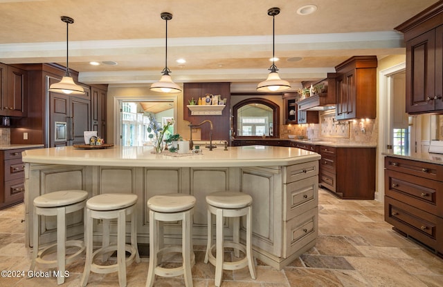 kitchen featuring stone tile flooring, decorative backsplash, a breakfast bar area, and open shelves