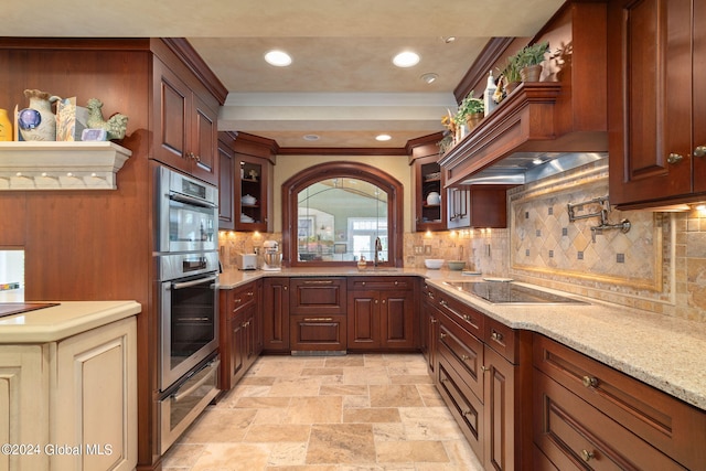 kitchen with a warming drawer, custom range hood, a sink, crown molding, and black electric stovetop