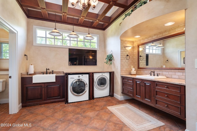 bathroom featuring washer and dryer, backsplash, coffered ceiling, and a healthy amount of sunlight