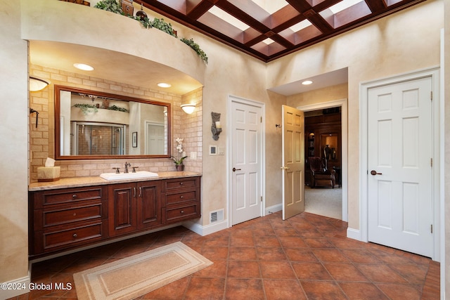 bathroom featuring visible vents, baseboards, coffered ceiling, and tile patterned flooring