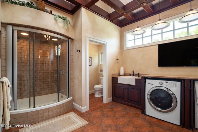 full bath with tile patterned flooring, baseboards, washer and dryer, coffered ceiling, and a sink