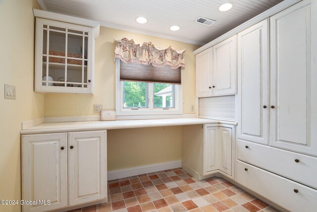 kitchen with visible vents, recessed lighting, white cabinets, light countertops, and built in study area