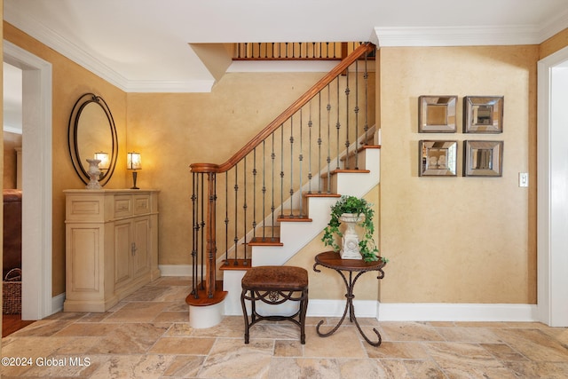 stairs with baseboards, stone tile flooring, and ornamental molding