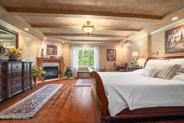 bedroom with beamed ceiling, recessed lighting, a fireplace, and wood-type flooring