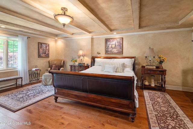 bedroom with beamed ceiling, ornamental molding, baseboards, and wood-type flooring