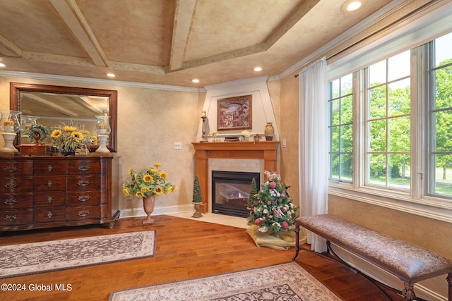 sitting room featuring a fireplace with flush hearth, hardwood / wood-style flooring, recessed lighting, crown molding, and baseboards