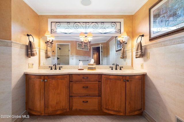 bathroom with visible vents, tile walls, walk in shower, and a sink