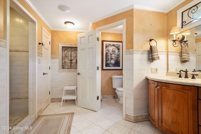 bathroom featuring tile patterned floors, toilet, tile walls, and vanity