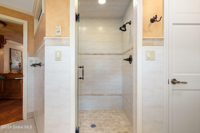 full bathroom with a stall shower and ornamental molding