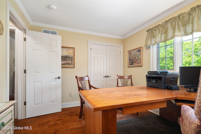 office featuring crown molding, wood finished floors, visible vents, and baseboards