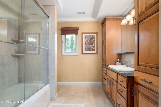 full bath with vanity, baseboards, visible vents, enclosed tub / shower combo, and tile patterned floors