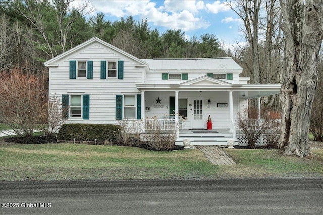 view of front of house featuring a porch and a front lawn