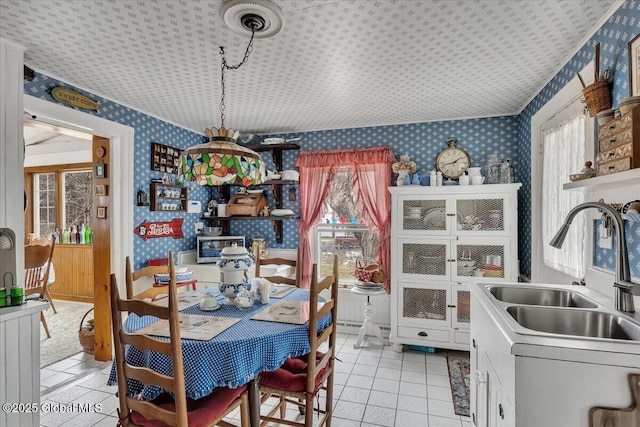 dining space featuring a wealth of natural light, wallpapered walls, and light tile patterned flooring