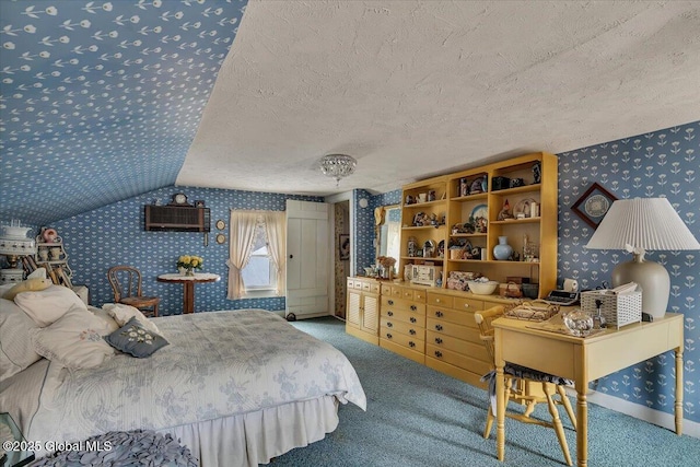 carpeted bedroom with wallpapered walls, vaulted ceiling, and a textured ceiling