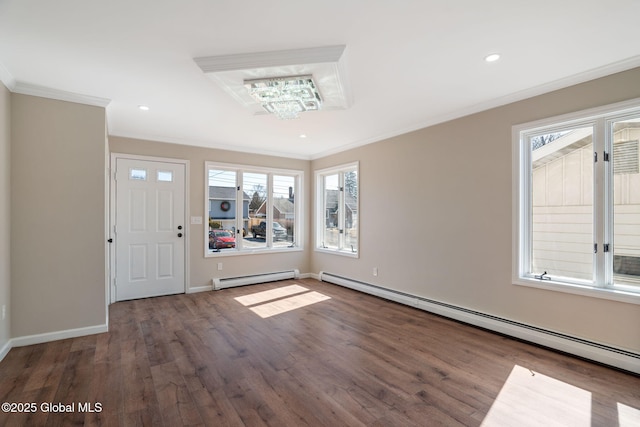 foyer with baseboard heating, an inviting chandelier, wood finished floors, and ornamental molding