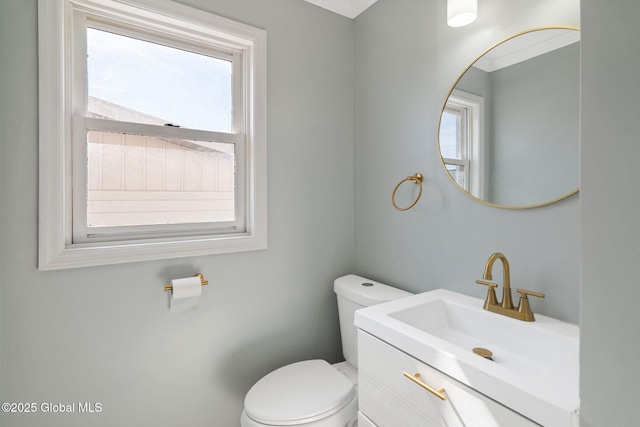 bathroom featuring toilet and vanity