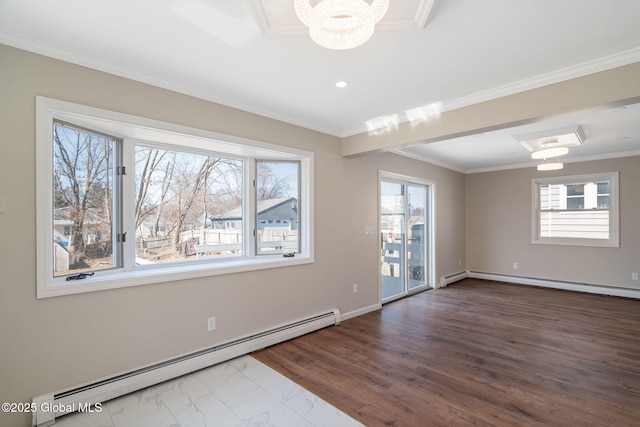 empty room featuring a wealth of natural light, a notable chandelier, baseboard heating, and ornamental molding