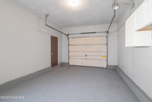 garage featuring baseboards