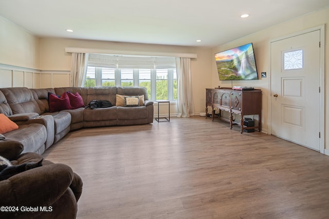 living area with recessed lighting and wood finished floors