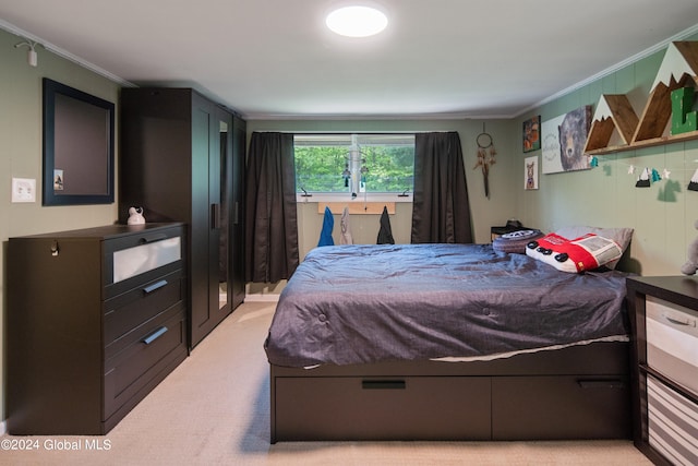 bedroom featuring light colored carpet and ornamental molding