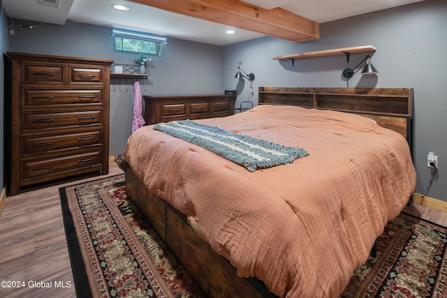 bedroom featuring beam ceiling, recessed lighting, visible vents, and light wood finished floors