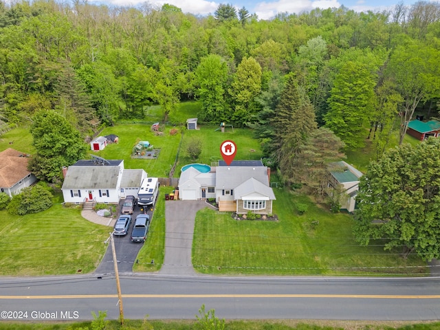 aerial view featuring a wooded view