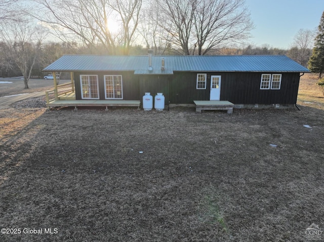 back of property with metal roof