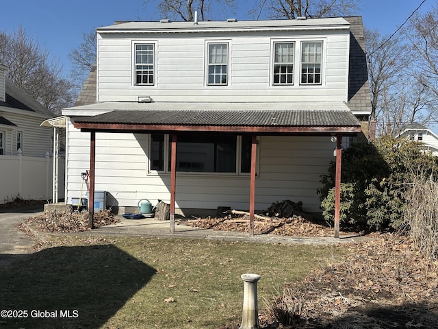 exterior space with a front lawn and fence