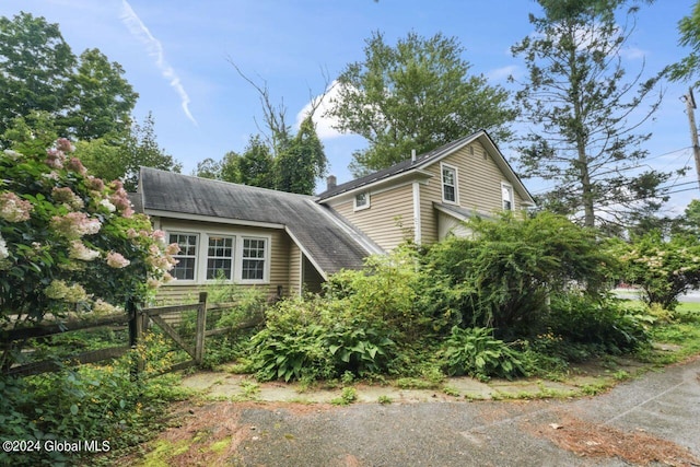 view of home's exterior featuring fence