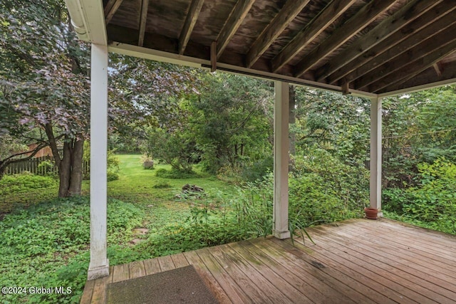 wooden terrace with a lawn