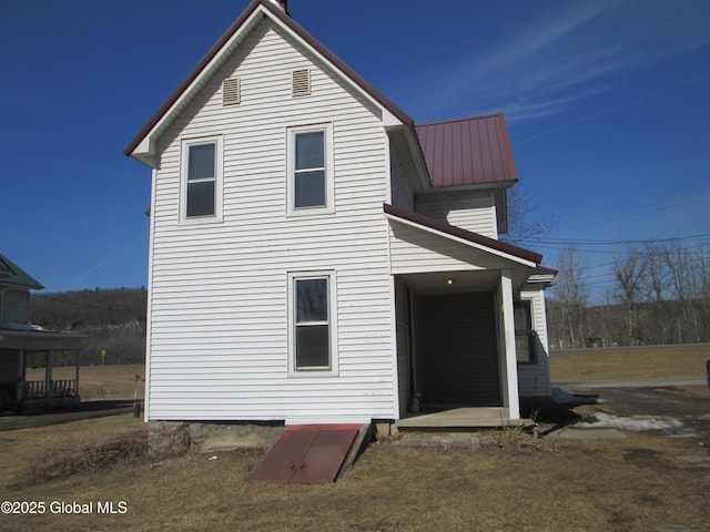 back of property with metal roof