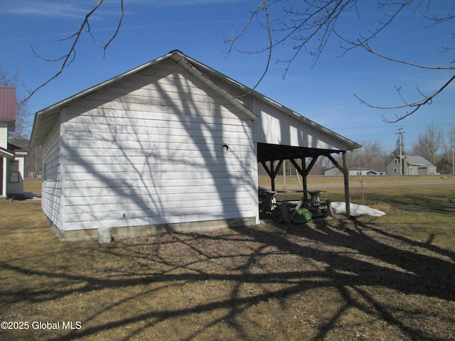 view of side of property with a yard