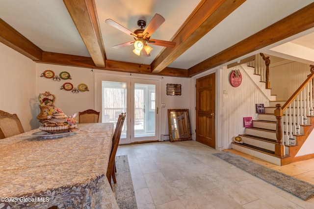 dining room with beamed ceiling, ceiling fan, and stairs