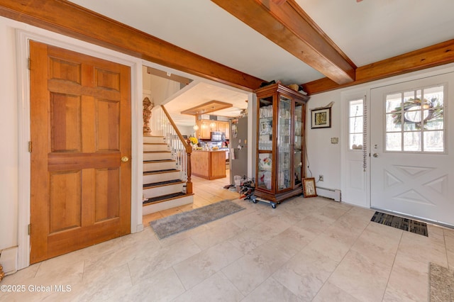 entrance foyer with beam ceiling, visible vents, stairs, and a baseboard radiator