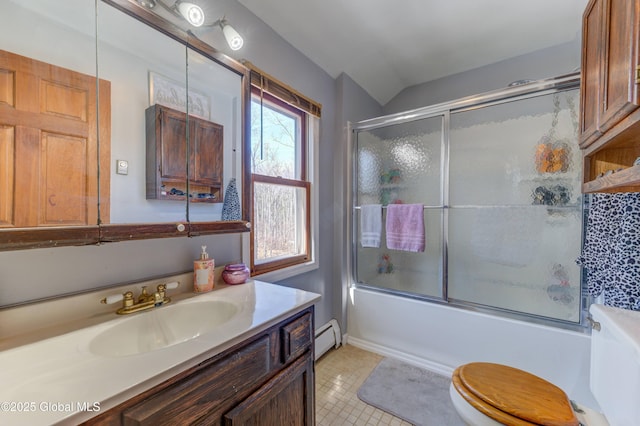 bathroom with a baseboard heating unit, vaulted ceiling, tile patterned floors, combined bath / shower with glass door, and vanity