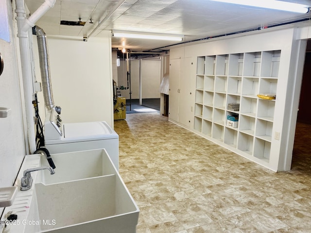 finished basement featuring independent washer and dryer and a sink