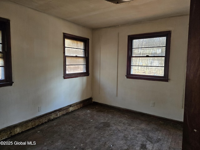 empty room featuring baseboards