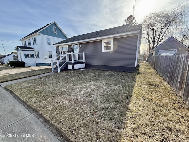 view of front of house featuring fence