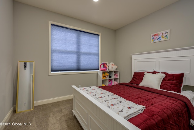 carpeted bedroom featuring baseboards