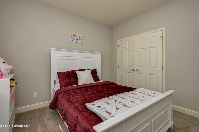 bedroom with baseboards and carpet floors